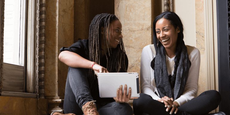 Two Generation Z women on an ipad